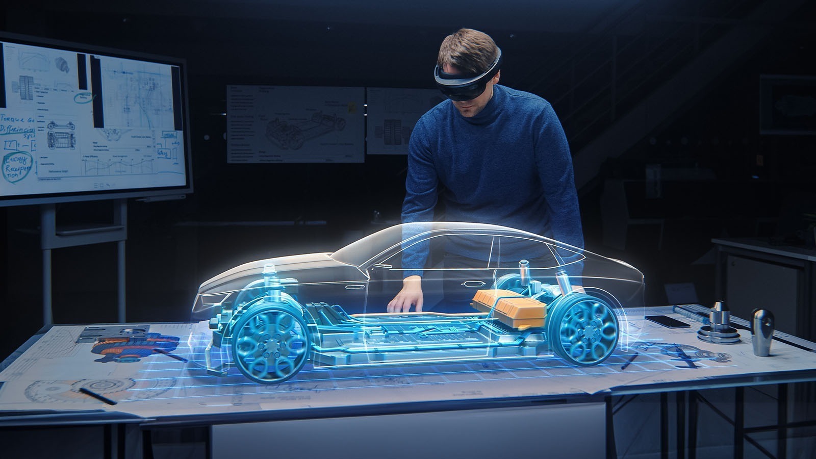 Engineer using VR to analyse a digital prototype vehicle
