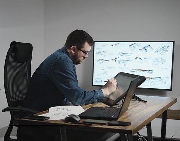 Automotive designer sketching a car exterior on a screen